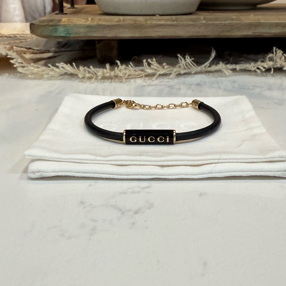 Gucci Black Bracelet with Gold Chain purchased 8/25/2025